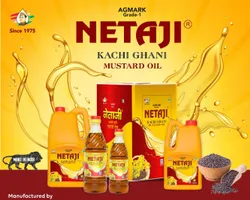 Golden Netaji mustard oil glistening in a steel kadhai with fresh vegetables being sautéed